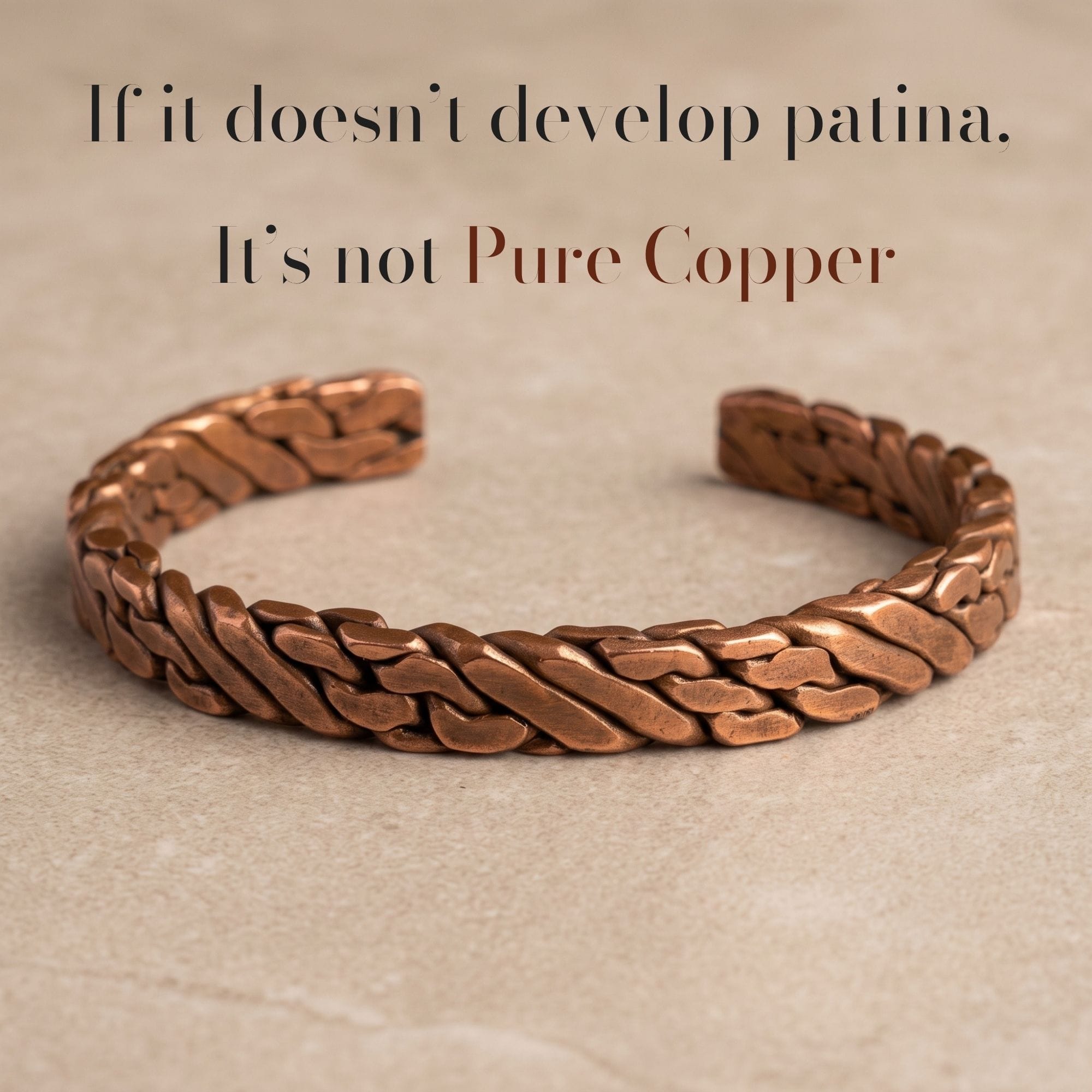 A heavy, hand-braided pure copper men's cuff bracelet resting on a textured stone surface, featuring the overlay text, "If it doesn't develop patina. It's not Pure Copper